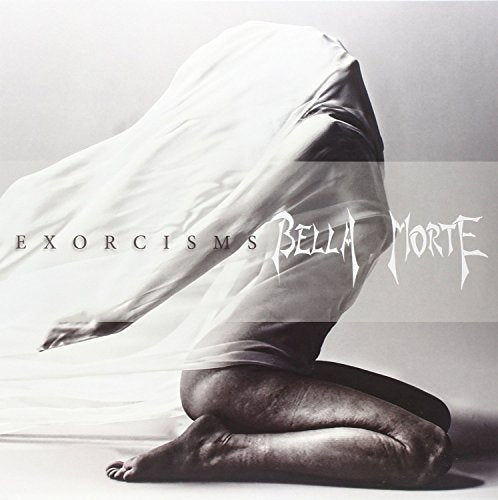 Black and white image of a person kneeling, covered by flowing white fabric, with text overlay.