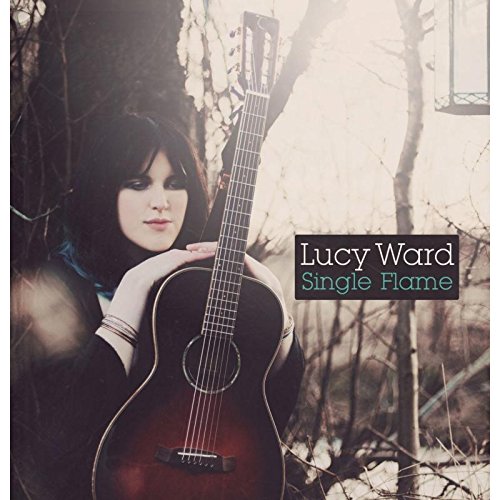 "Album cover featuring a woman holding an acoustic guitar, outdoors, with text overlay."
