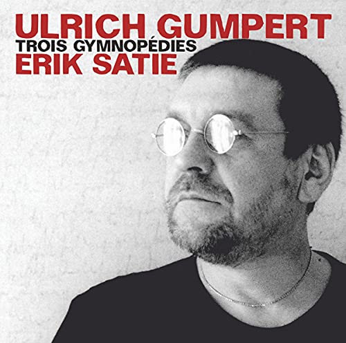 CD cover featuring a black and white portrait of a man with glasses.