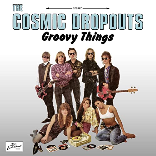 Vinyl album cover featuring a group of people in 1970s style clothing.