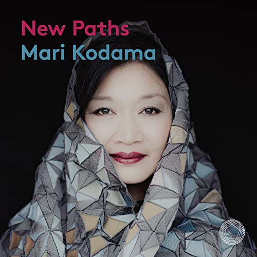 Mari Kodama album cover: portrait of a woman with patterned fabric.