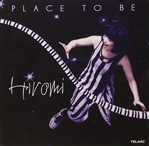CD cover: Hiromi leaping against a starry night sky.