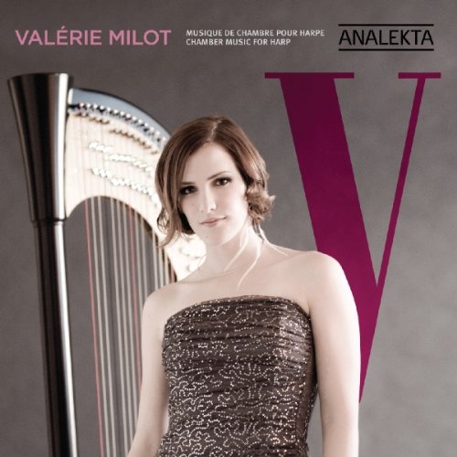 A woman in a sparkly dress stands beside a harp, on a grey background.