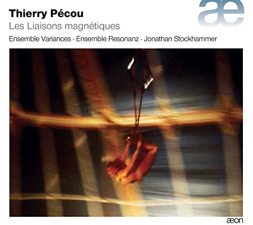 Compact disc cover featuring a blurred image of a red object suspended.