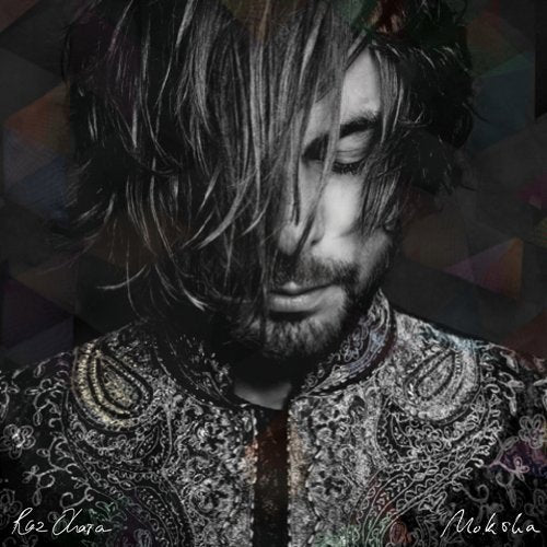A man with long hair and patterned shirt on a dark background.