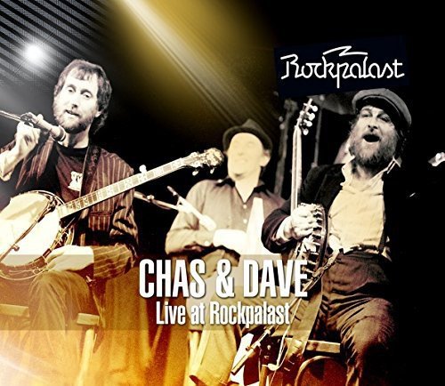 "CD cover featuring two men singing into a microphone under stage lights."