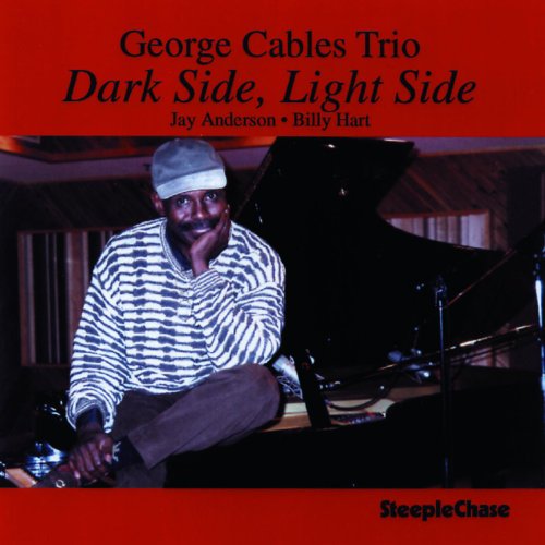 CD cover featuring George Cables with a piano, red background.