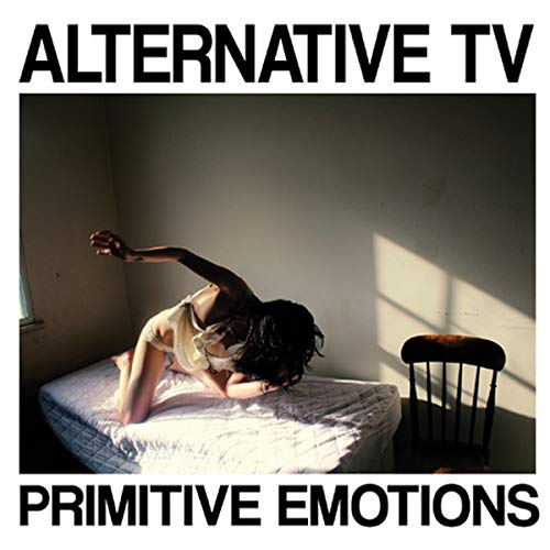 Person lying on bed in dimly lit room, Alternative TV CD cover.
