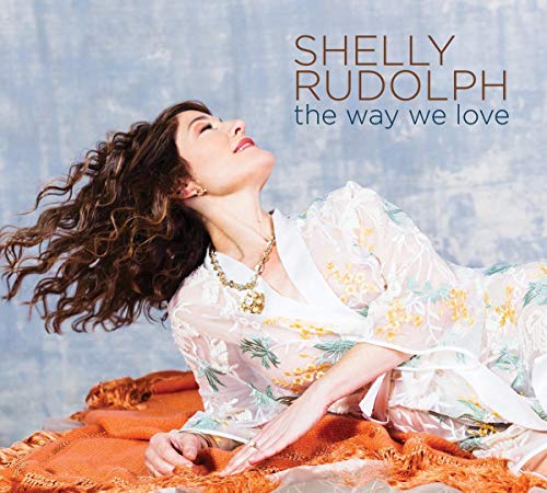 Shelly Rudolph's album cover featuring a woman lying on an orange fabric.