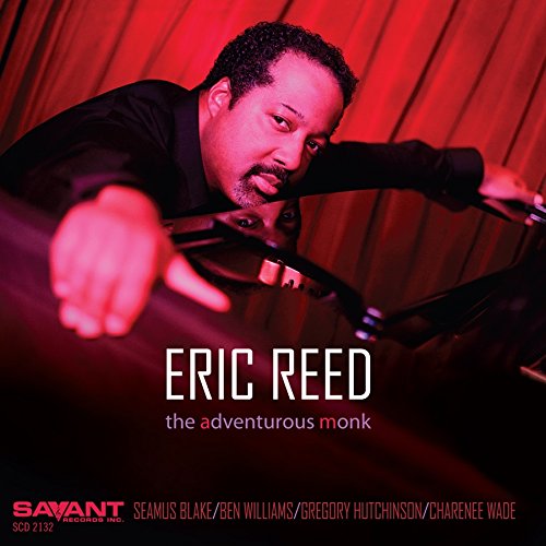 "Album cover featuring a man leaning over a piano keyboard with red lighting."