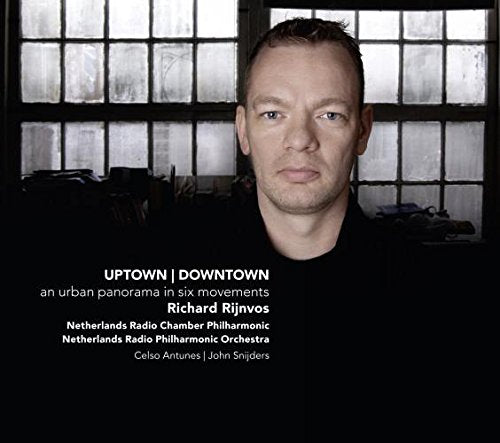"CD cover featuring a man in a black shirt against a window backdrop."
