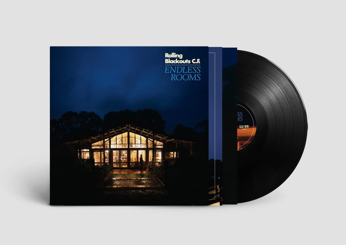 Album cover for Rolling Blackouts C.F. featuring a lit, large glass house.