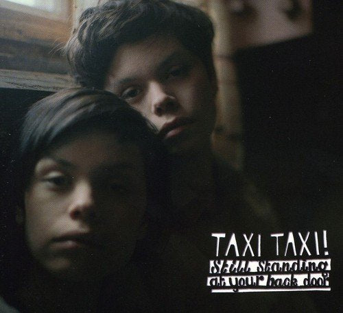 "CD cover with two people and 'Taxi Taxi!' text, with additional text below."