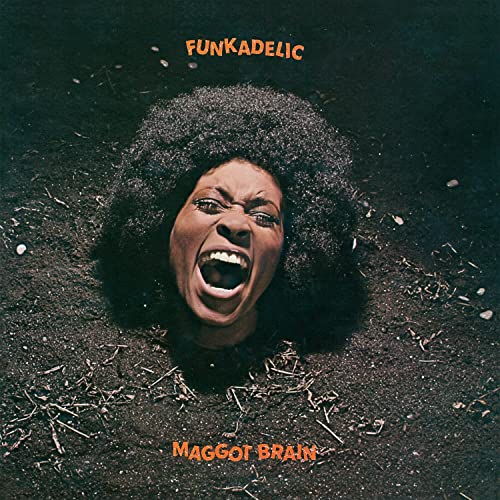 Album cover: a Black man with an anguished expression emerging from dirt.