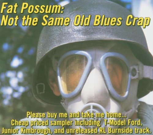 "Album cover featuring a person wearing a helmet and gas mask, with pink text overlay."