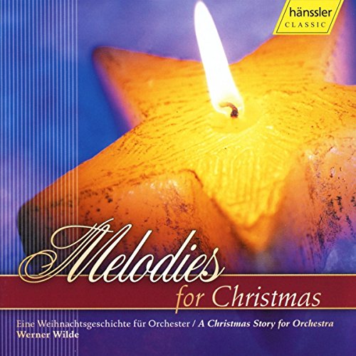 A lit candle on a Christmas CD cover with "Melodies for Christmas" text.