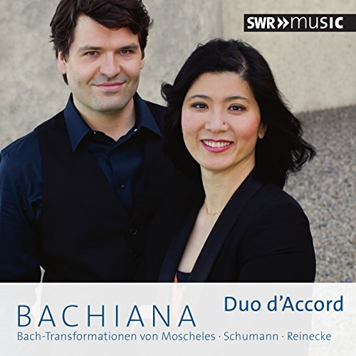 CD cover featuring a man and woman in dark attire against a grey background.