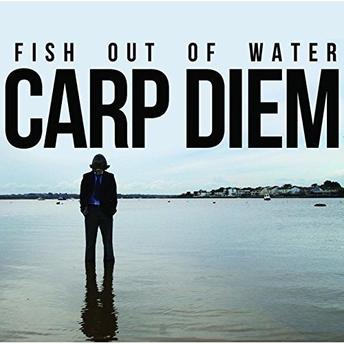 "CD cover featuring a man in a suit standing in shallow water."