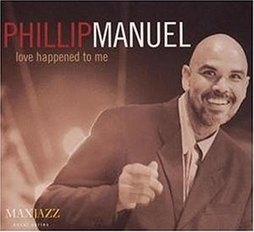 "CD cover featuring Phillip Manuel in a suit, smiling and gesturing."