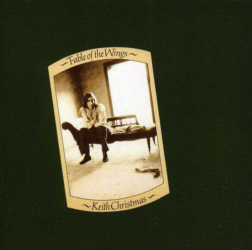 "CD cover with sepia-toned man sitting on a bed, against a dark green background."