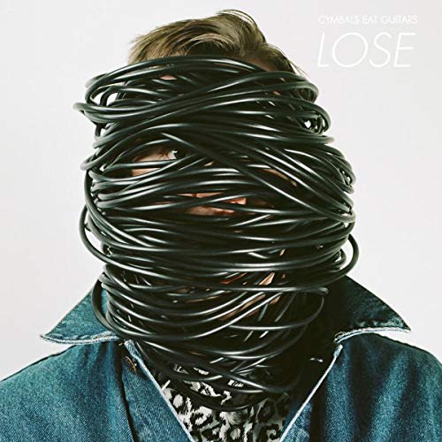 CD cover: face obscured by black cables, denim jacket visible.