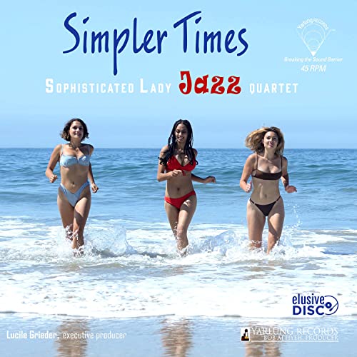 Three women in bikinis run through shallow ocean waves on a sunny beach.