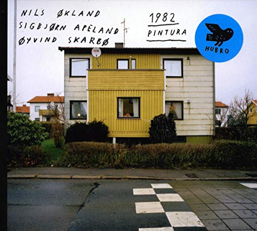 CD cover: Yellow and beige apartment building with text and a bird logo.