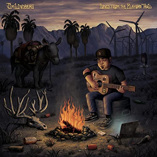 CD cover: man with guitar, donkey, campfire, and desert landscape.