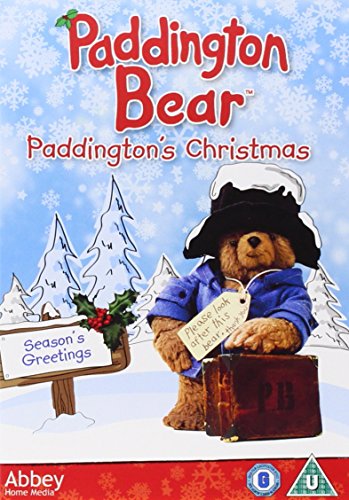 Paddington Bear with suitcase, snowy background, DVD cover art.