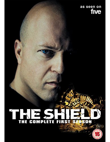 DVD cover for "The Shield - Season 1" featuring a man with a shaved head.
