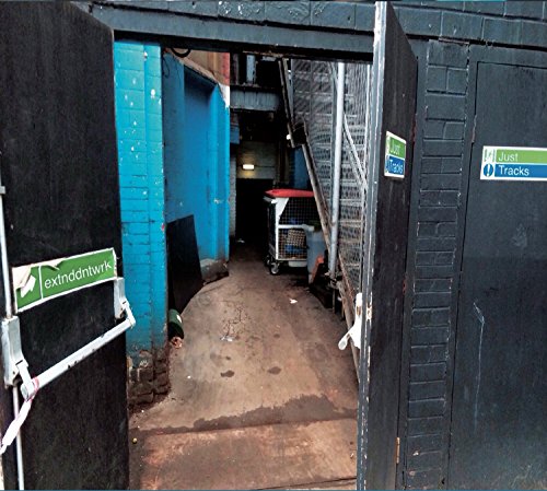 CD album “Just Tracks” artwork: an alleyway seen through open doors.