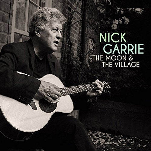 Man playing guitar, album cover with title "The Moon & The Village" by Nick Garrie.