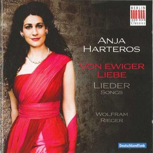 CD cover featuring a woman in a red dress against a stone background.