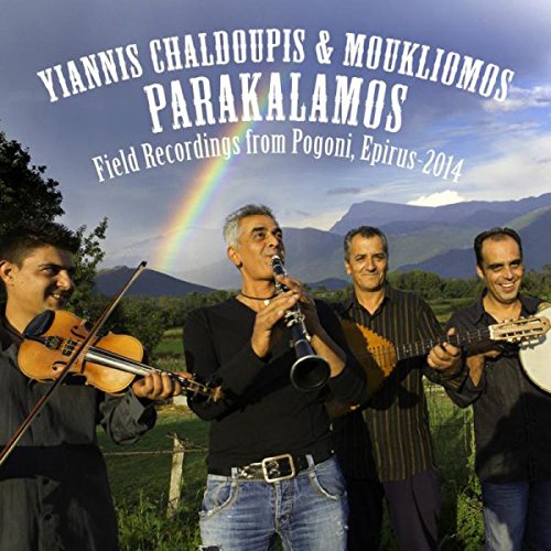 "CD cover featuring four men playing instruments outdoors with mountains and rainbow."