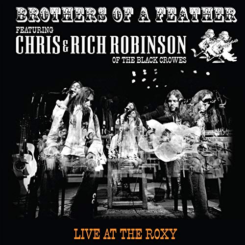 "CD cover featuring a black-and-white photo of musicians performing on stage."