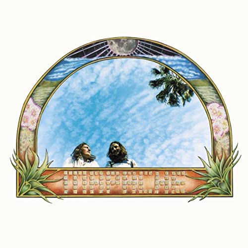 Album cover with two people looking up at a palm tree and sky.