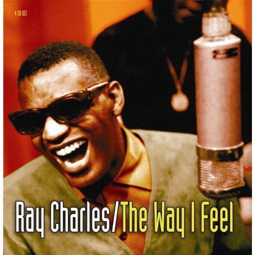 "CD cover featuring Ray Charles singing into a microphone, wearing sunglasses."