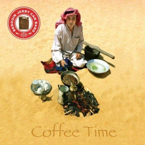 Man in traditional Middle Eastern attire sits on sand, surrounded by coffee-making equipment.