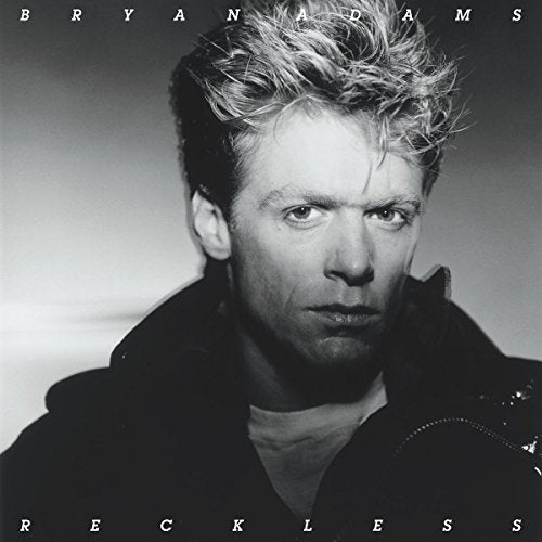 Black and white vinyl album cover featuring Bryan Adams with messy hair and dark jacket.