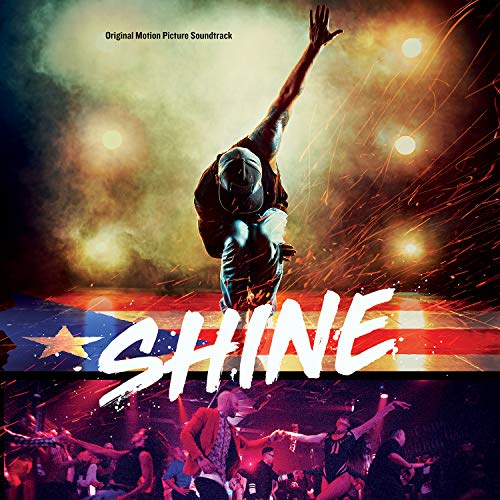 The image is a soundtrack cover for "Shine". Alt text: Dancer on stage with crowd below, "SHINE" in white letters.