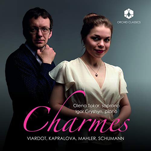 CD cover featuring a man and woman, with the title "Charmes" overlaid.