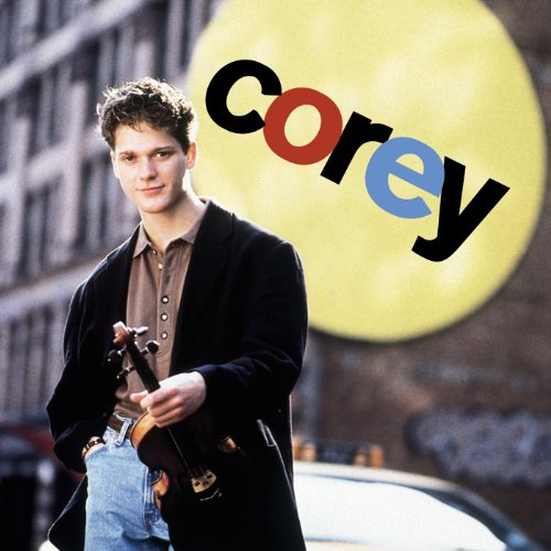 The image depicts a man holding a violin, with the name "Corey" superimposed.
