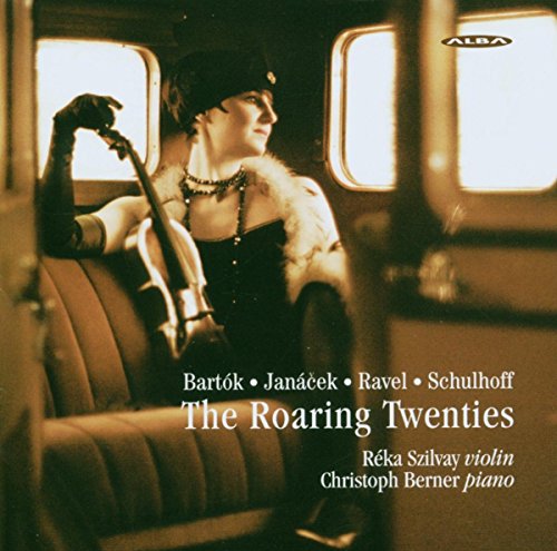 "CD cover with a woman in 1920s attire holding a violin in a train carriage."