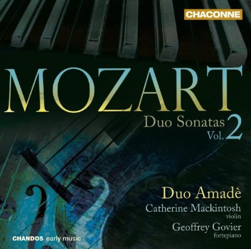 A CD cover featuring piano keys and a violin with text "Mozart Duo Sonatas Vol. 2".