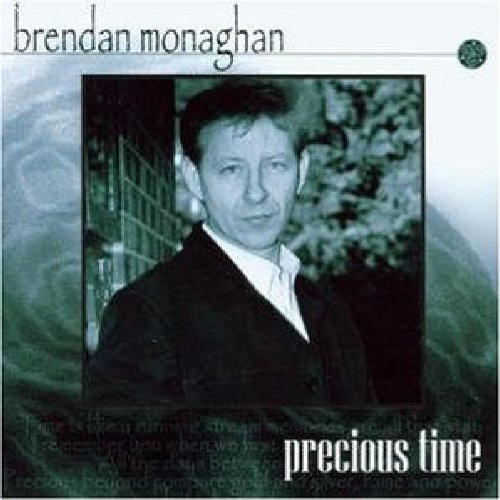 "Album cover with a black and white photo of a man in a suit."
