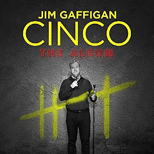 "Album cover with Jim Gaffigan holding a microphone, standing in front of a gray wall."