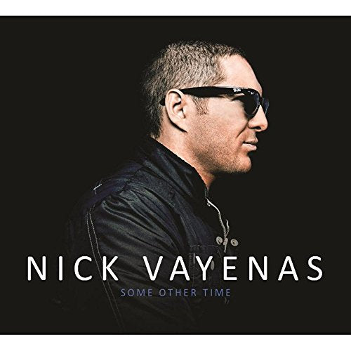 "Album cover featuring a man in sunglasses against a black background with text."