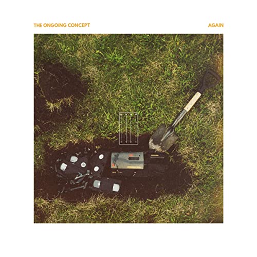 CD cover: broken cassette tapes and a shovel in grass.