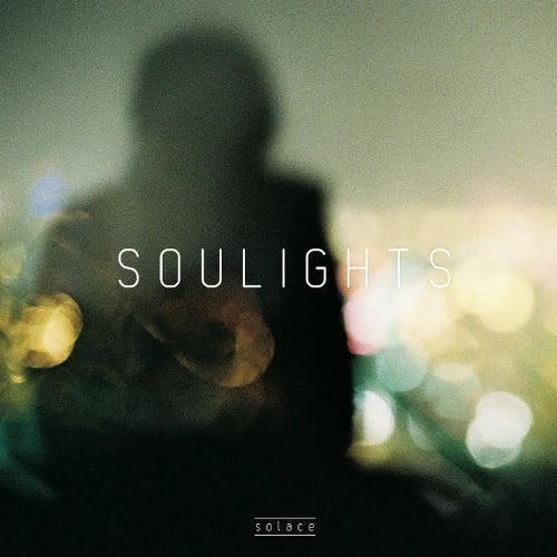 CD cover for “Solace” featuring a blurred figure and lights.
