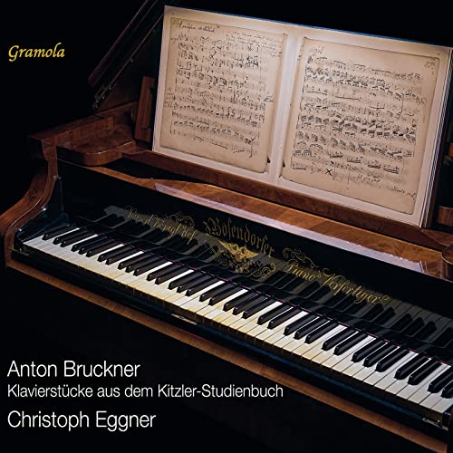 Piano with open sheet music, album cover for Christoph Eggner’s piano pieces.